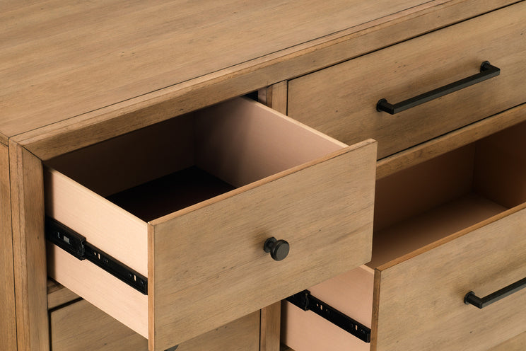 Wooden dresser with open drawer and closed drawers